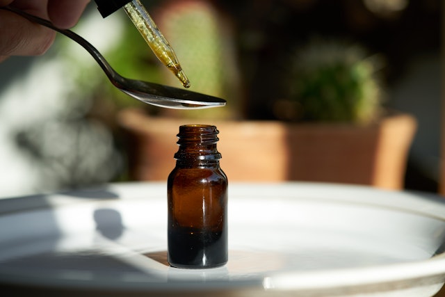 Cbd Tincture dripping close up